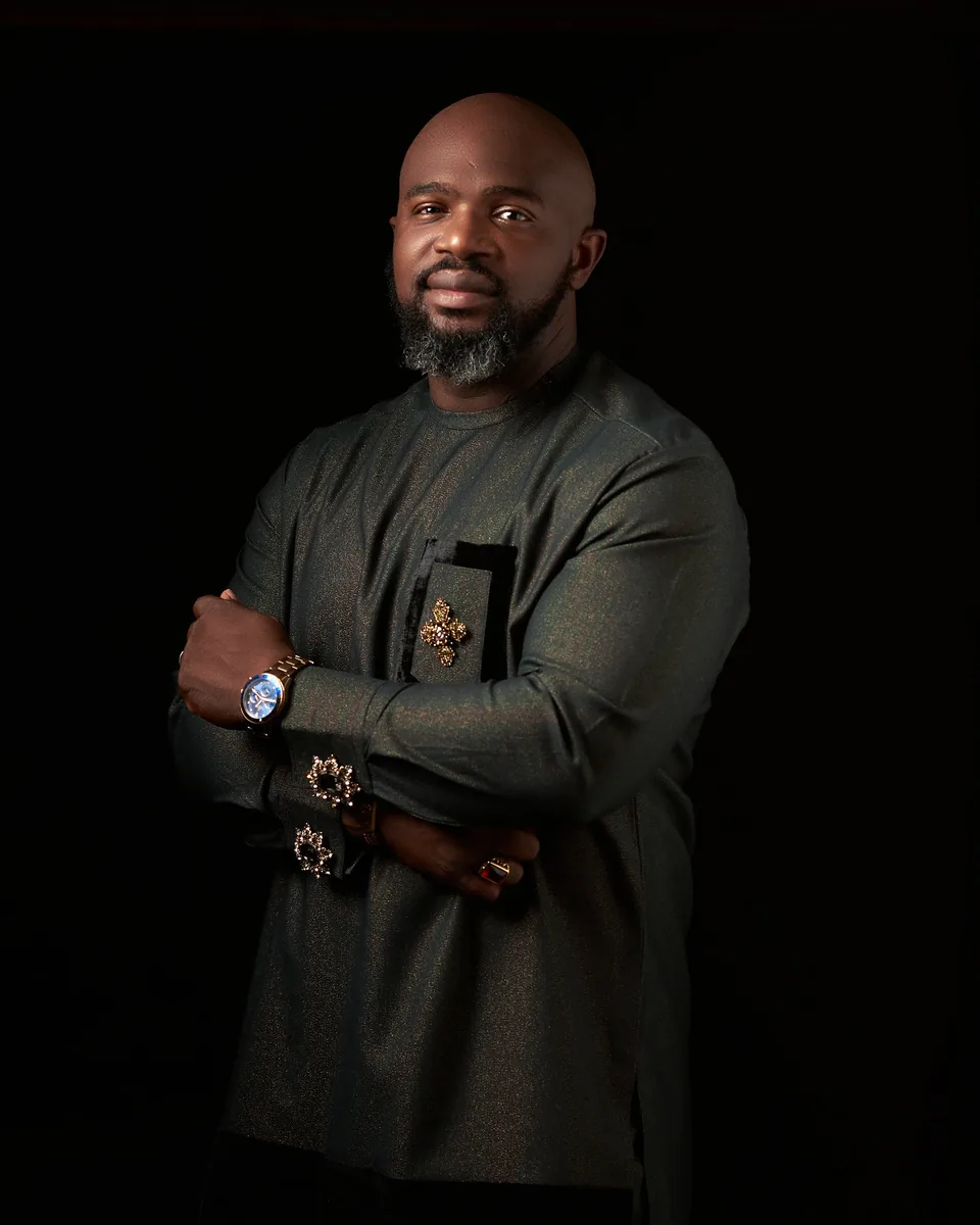 Portrait of a man standing with folded arms