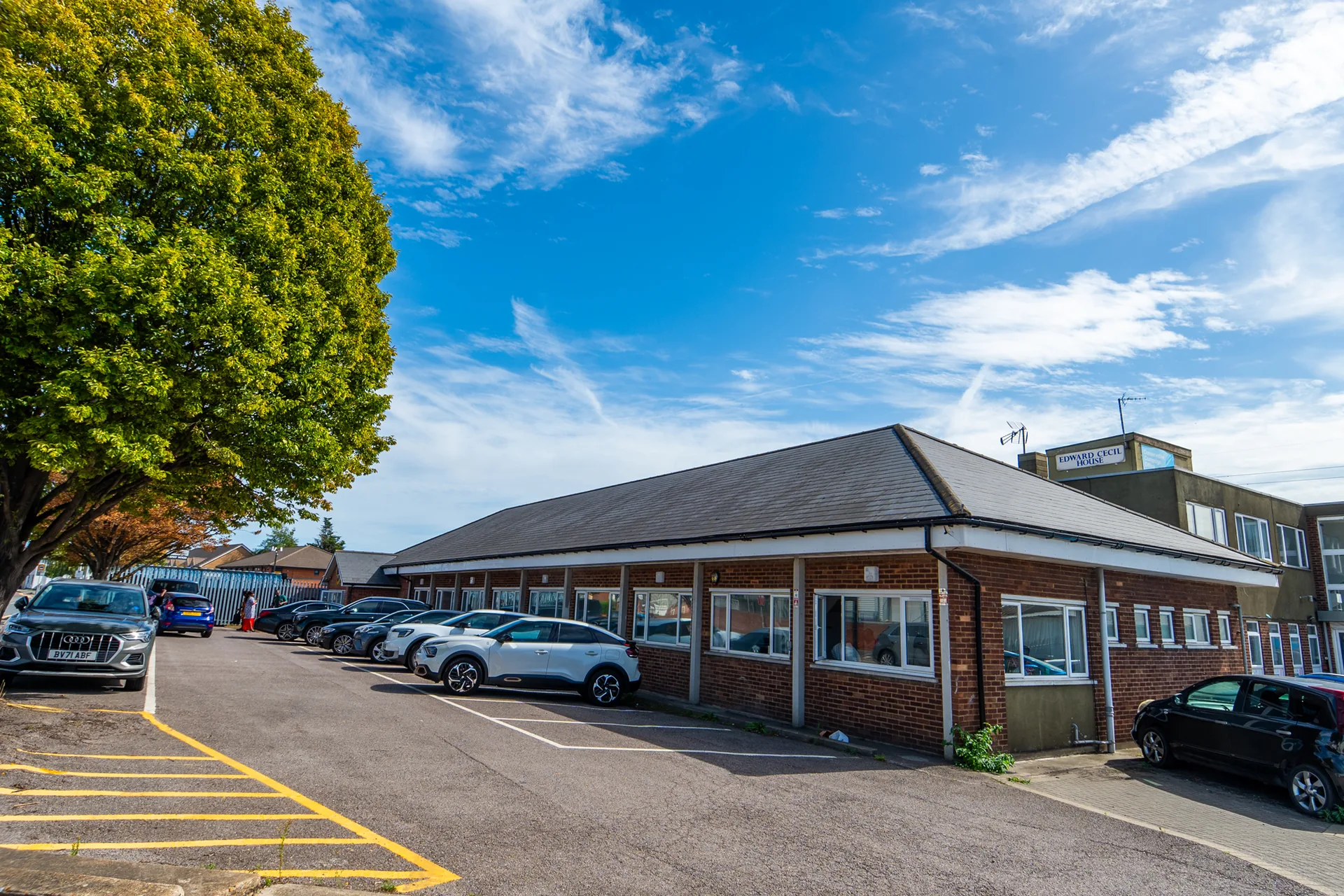The Encounter Arena building and car park viewed from the approach