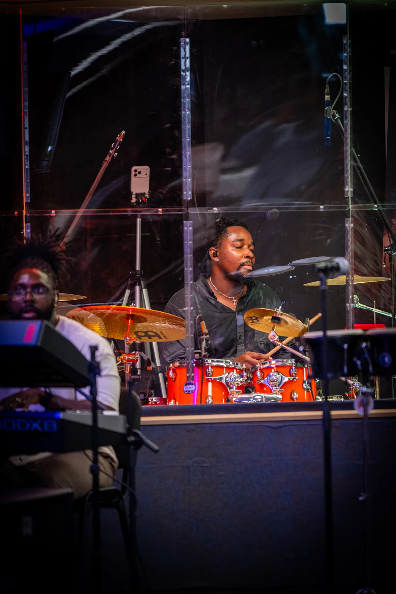 A musician playing a drum kit